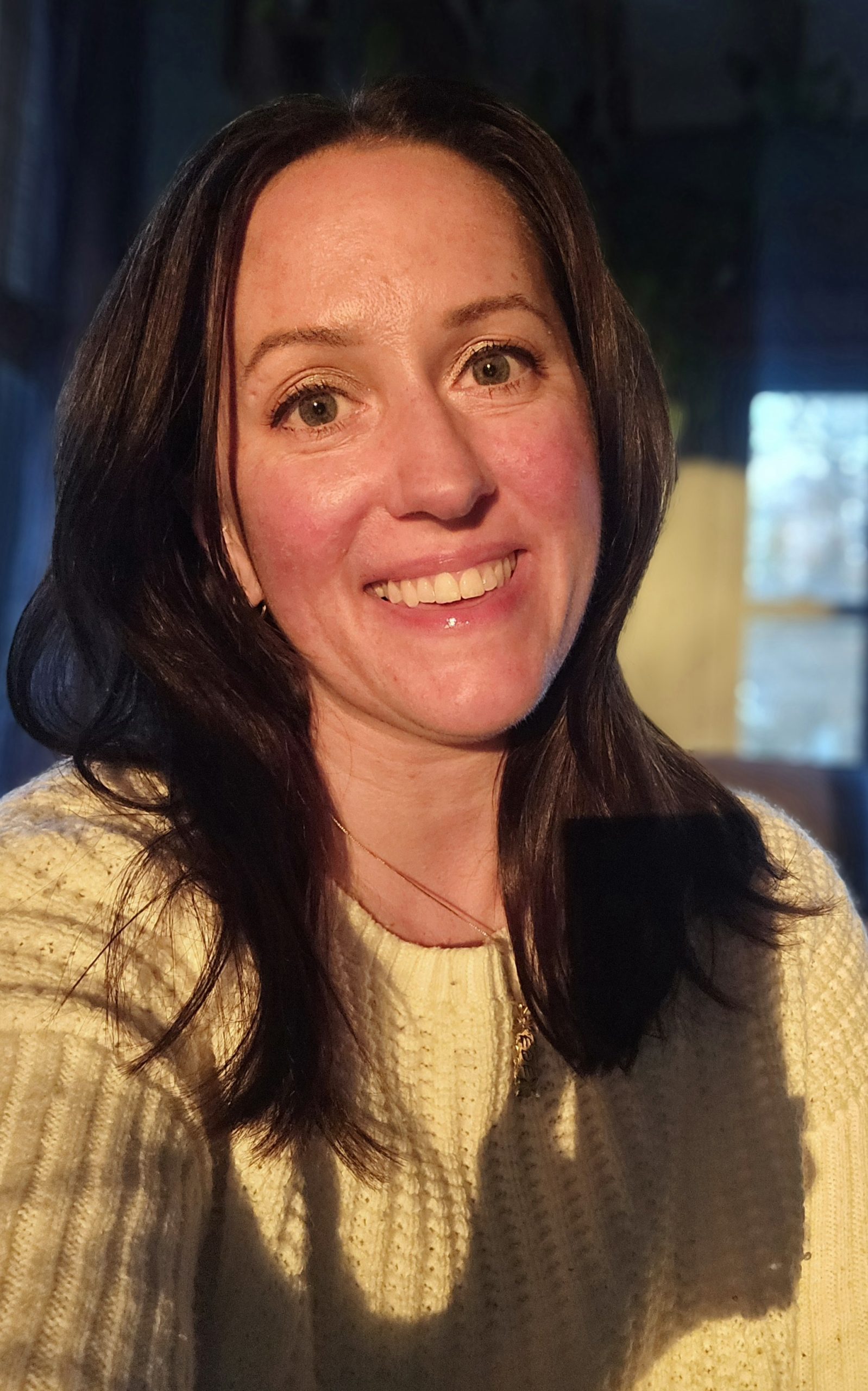 Woman smiling warmly at camera